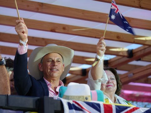 Gina Rinehart and Adam Giles cheering at the Volleyball